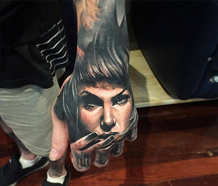 Woman on hand tattoo by Benjamin Laukis